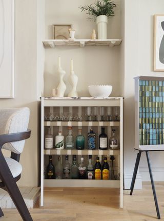 a mini bar cabinet painted with stripes on the inside