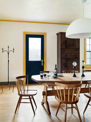 A brightly painted door frame in yellow