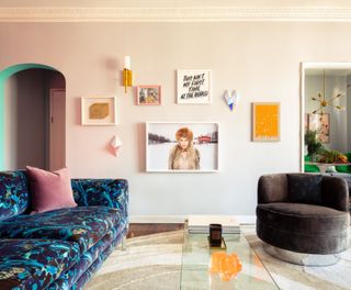 a colorful living room with a painted door arch